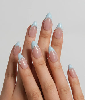 Oyster Blue coastal French nails with warm nude base, tiny pearls, and soft blue tips