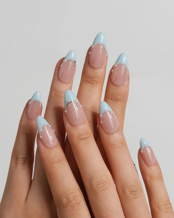 Oyster Blue coastal French nails with warm nude base, tiny pearls, and soft blue tips