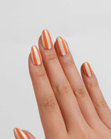 Parasol extra short almond nail set with bold orange cream vertical lines