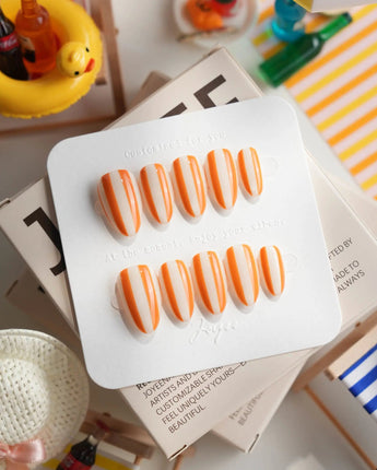 Parasol warm tangerine striped press-on nails with clean retro summer design