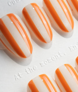 Parasol hand-painted striped nails inspired by vintage beach umbrellas