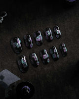 Party Spirits press on nails with holographic teal, lilac and pink glitter ghosts on a glossy black base - image 2