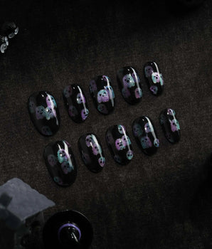 Party Spirits press on nails with holographic teal, lilac and pink glitter ghosts on a glossy black base - image 2