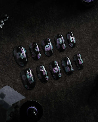 Party Spirits press on nails with holographic teal, lilac and pink glitter ghosts on a glossy black base - image 2