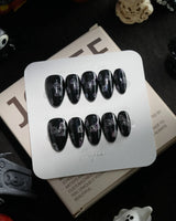 Party Spirits handmade press-on nails in extra short almond shape by Joyee Nails