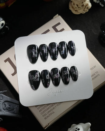 Party Spirits handmade press-on nails in extra short almond shape by Joyee Nails