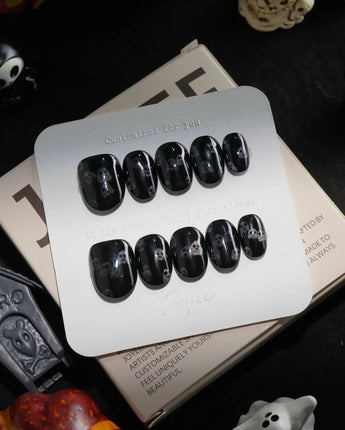 Party Spirits handmade press-on nails in extra short oval shape by Joyee Nails