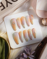 Pastel Relic in medium stiletto shape with champagne gradient and gold starburst lines