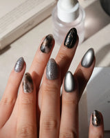 Patina press on nails with copper brushwork over black and grey smoke marble, silver grey cat eye and a copper gothic arch on black - image 2