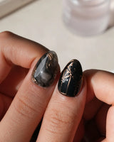 Patina press on nails with copper brushwork over black and grey smoke marble, silver grey cat eye and a copper gothic arch on black - image 4