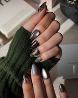 Patina press on nails with copper brushwork over black and grey smoke marble, silver grey cat eye and a copper gothic arch on black - image 5