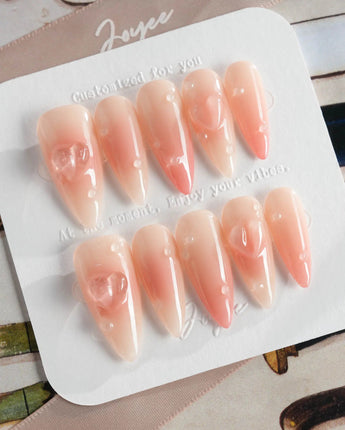 Peach Dew medium almond nails with translucent peach art and soft glossy finish