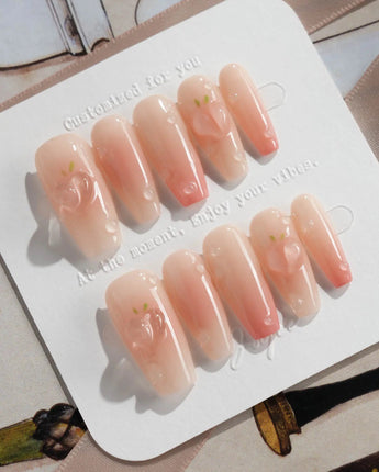 Peach Dew tender peach nails with nude base, glossy gel, and dewdrop accents