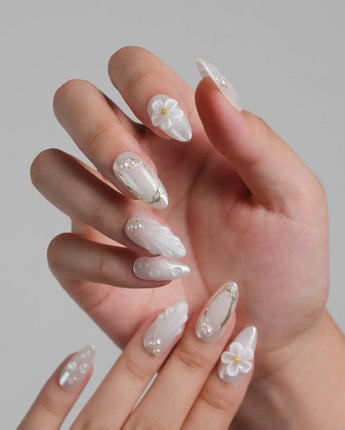 Pearl Bloom press-on nails in medium almond shape — Pure White Pearlescent, 3D Flowers & Shell Texture.