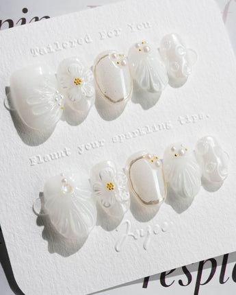 Pearl Bloom press-on nails in extra short oval shape — Pure White Pearlescent, 3D Flowers & Shell Texture.