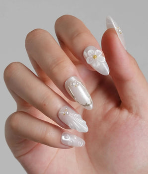 Pearl Bloom handmade press-on nails featuring Pure White Pearlescent, 3D Flowers & Shell Texture.