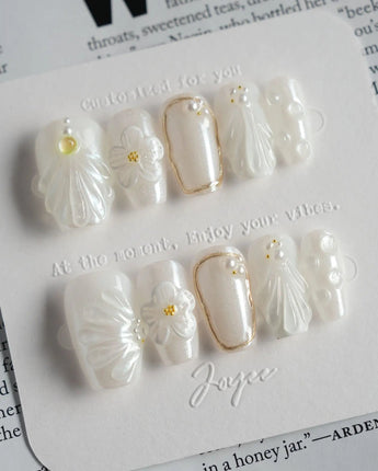 Pearl Bloom press-on nails in short coffin shape — Pure White Pearlescent, 3D Flowers & Shell Texture.