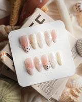 Pearl Dot short almond nail set with soft pink, gold and white mother-of-pearl shine