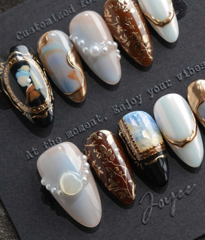 Pearl Earring S press-on nails in short almond with gold-framed portrait and pearls