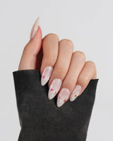 Petal Press press-on nails in medium almond shape — Warm Creamy Skin Tone, Hand-painted Florals & glitter Shimmer.