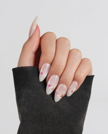 Petal Press press-on nails in medium almond shape — Warm Creamy Skin Tone, Hand-painted Florals & glitter Shimmer.