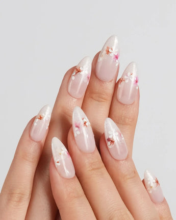 Petal Press nail art close-up showing Warm Creamy Skin Tone, Hand-painted Florals & glitter Shimmer. details