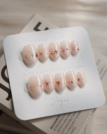 Petal Press press-on nails — Warm Creamy Skin Tone, Hand-painted Florals & glitter Shimmer. handmade nail art by Joyee Nails