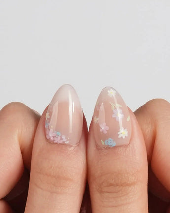 Petal Rain nail art close-up showing nude, 3D White Butterfly Wings & Pastel Wildflowers. details