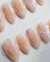 Petal Rain handmade press-on nails featuring nude, 3D White Butterfly Wings & Pastel Wildflowers.