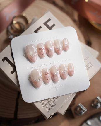 Pillow Talk nails in extra short almond — Pearl Satin Pink, Lace