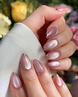 Glowing Stone - New Edition handmade press-on nails featuring Gentle Rose Cat Eye, Simple Silver Outlines.