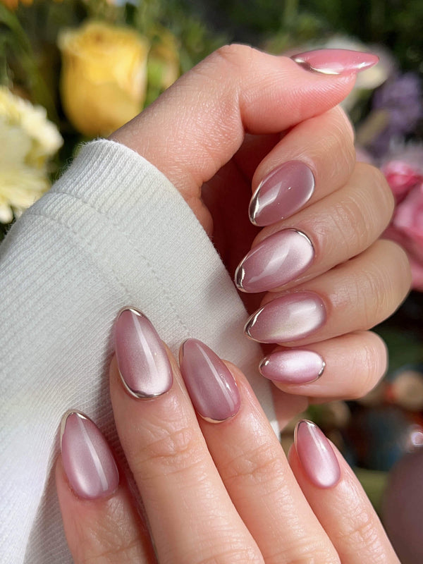 Pink cat eye press on nails showcasing stylish cat eye effect
