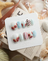 Pink Grapefruit citrus press-on nails in extra short oval shape