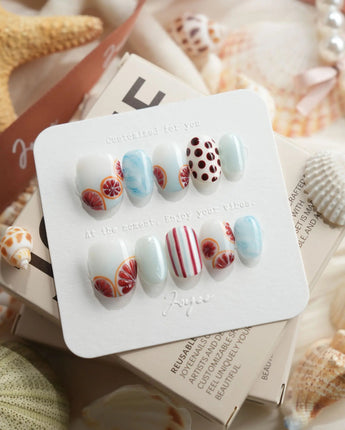 Pink Grapefruit citrus press-on nails in extra short oval shape