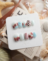 Pink Grapefruit citrus press-on nails in extra short squoval shape