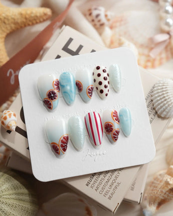Pink Grapefruit citrus press-on nails in short almond shape