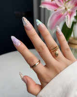 Wonderland Whims pearl flower nail art on a soft pink glossy base for spring styling