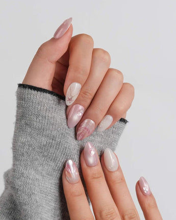 Pink Treasure glossy marble press-on nails with starfish pendant and pearl shell texture