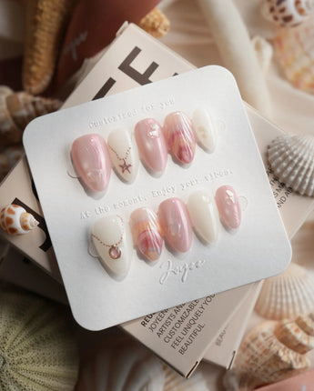 Pink Treasure extra short almond nails with silver jewelry charm accents