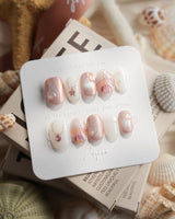 Pink Treasure extra short oval press-on nails with mother-of-pearl shell fragments