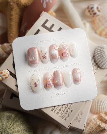 Pink Treasure extra short oval press-on nails with mother-of-pearl shell fragments