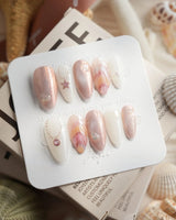 Pink Treasure medium almond press-on nails with rose marble and silver charm details