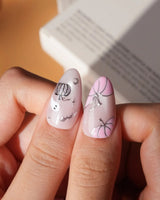 Pinkoween pink Halloween press on nails with pink pumpkins, a glitter ghost, silver bats and moons and holographic silver glitter nails - image 4