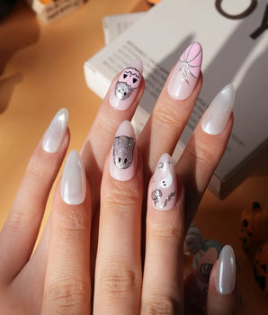 Pinkoween pink Halloween press on nails with pink pumpkins, a glitter ghost, silver bats and moons and holographic silver glitter nails - image 3