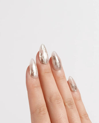 Plume nail art close-up showing Elegant Nude, Brushed Gold Foil Feathers & Fluid Textures. details