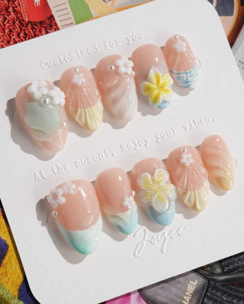 Plumeria-Island Breeze press-on nails in extra short almond shape — Dreamy Macarons, 3D Plumeria & Shell Textures.
