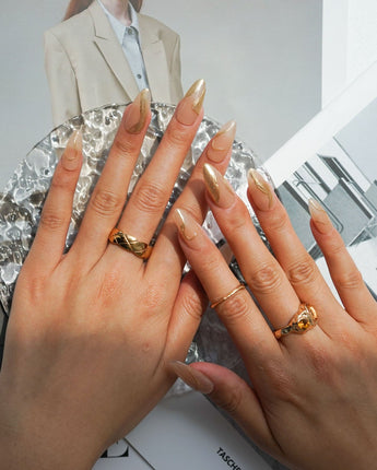 Poetic Glamour Nude nail art close-up showing nude french tip gold line details