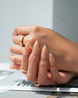 Poetic Glamour Nude handmade press-on nails featuring nude french tip gold line