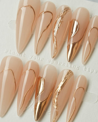 Poetic Glamour Nude press-on nails in long stiletto shape — nude french tip gold line