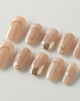 Poetic Glamour Nude press-on nails in short oval shape — nude french tip gold line